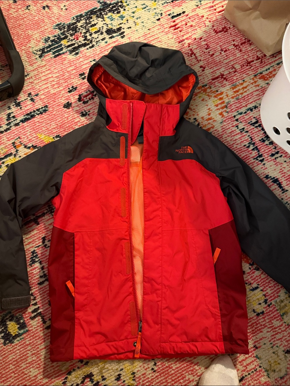 The North Face Red Jacket with Charcoal Hood & Orange Accents
